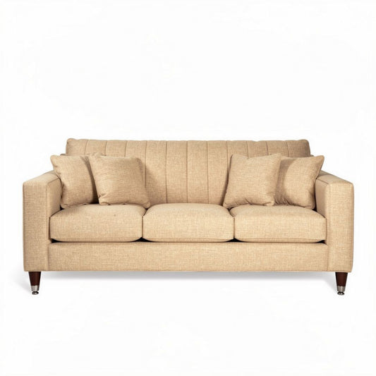 Sofá de tela beige con cojines y dimensiones de 200 x 90 x 85cm